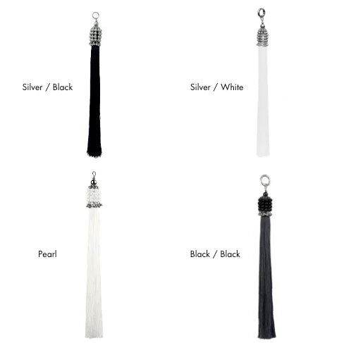 Four tassels in different colors with color names in text on a white background