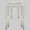 Decorative beaded belt made with synthetic pearls, and white thread tassels on a gray background