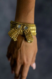 Object & Dawn ghost images of Amaya Bow band 22k gold wash close up view ghost image