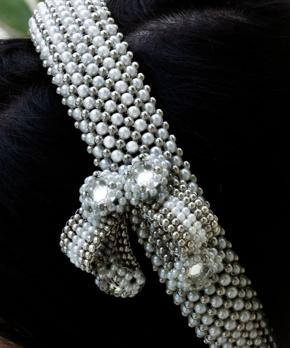 woman in black outfit wear handcrafted beaded modular headband with trinity medallion by object and dawn close up beads