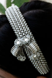 woman in black outfit wear handcrafted beaded modular headband with trinity medallion by object and dawn close up beads
