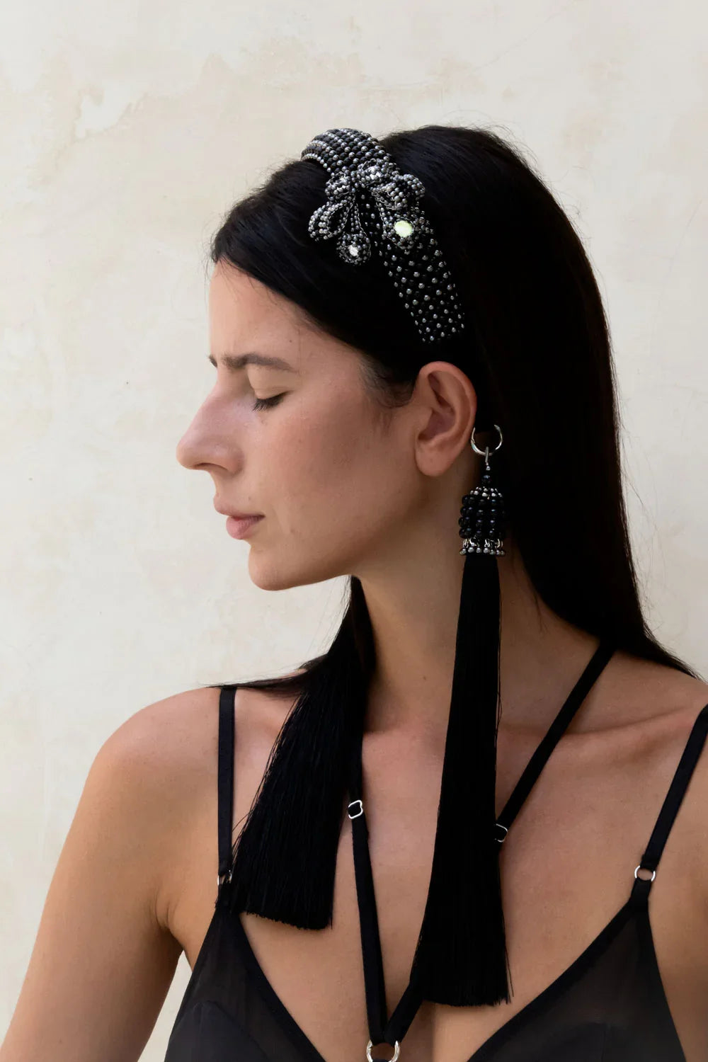 woman showing side view of Silver beaded with black crystals Teuta headband by Object & Dawn worn by a person with a neutral background