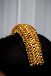 Gold beaded Anais headband worn by a person with a neutral background by Object & Dawn