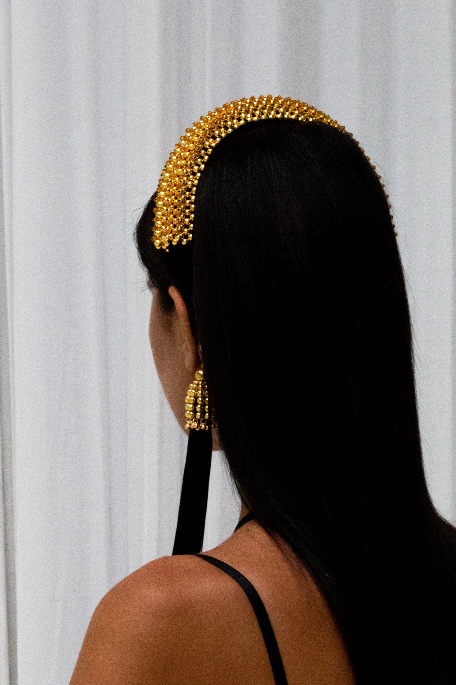 Object & Dawn Beaded Anais Modular Headband in gold wear by woman from back view