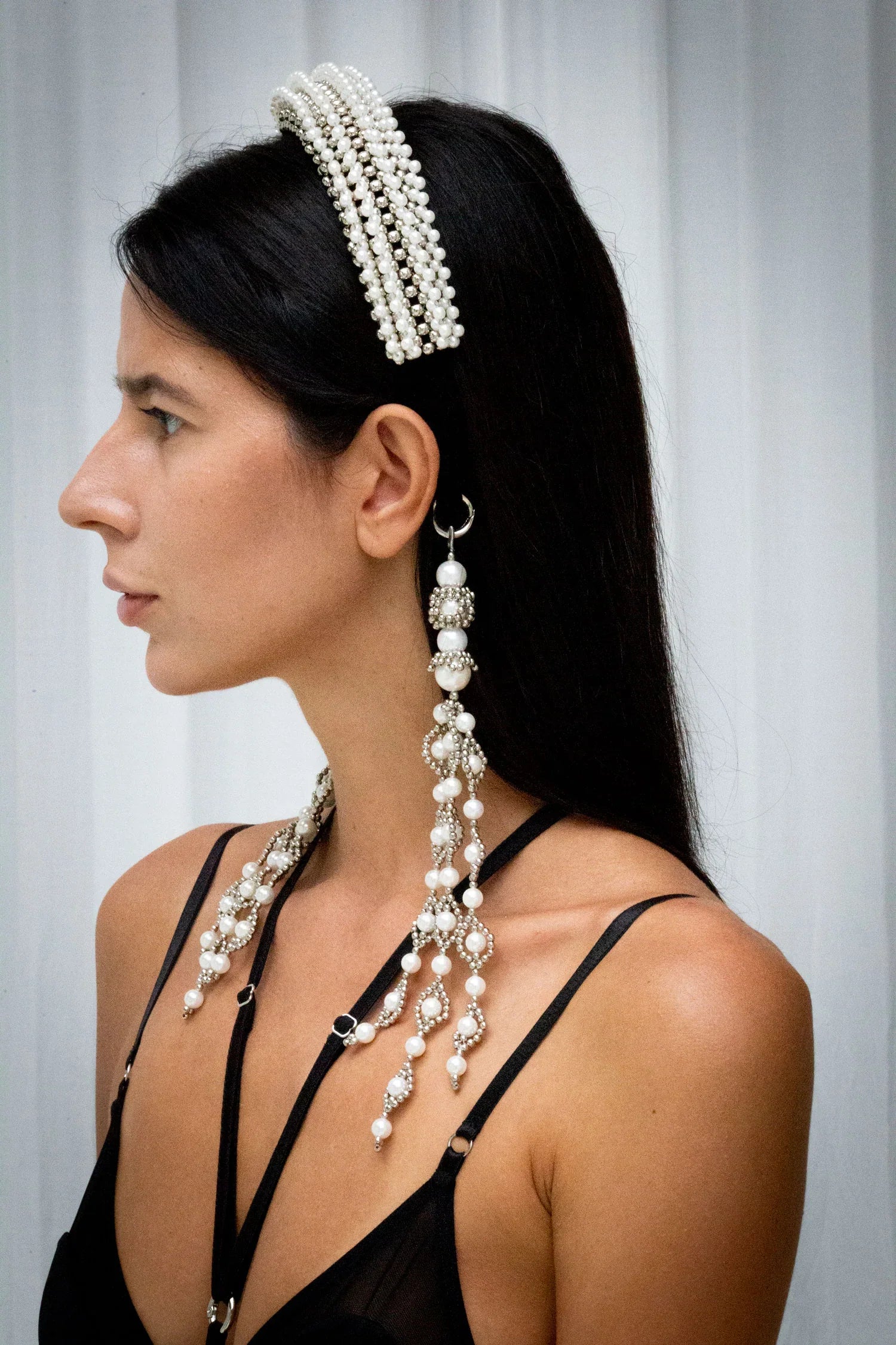 woman in black outfit wear Anais Headband in pearl with trinity medalions by object & Dawn