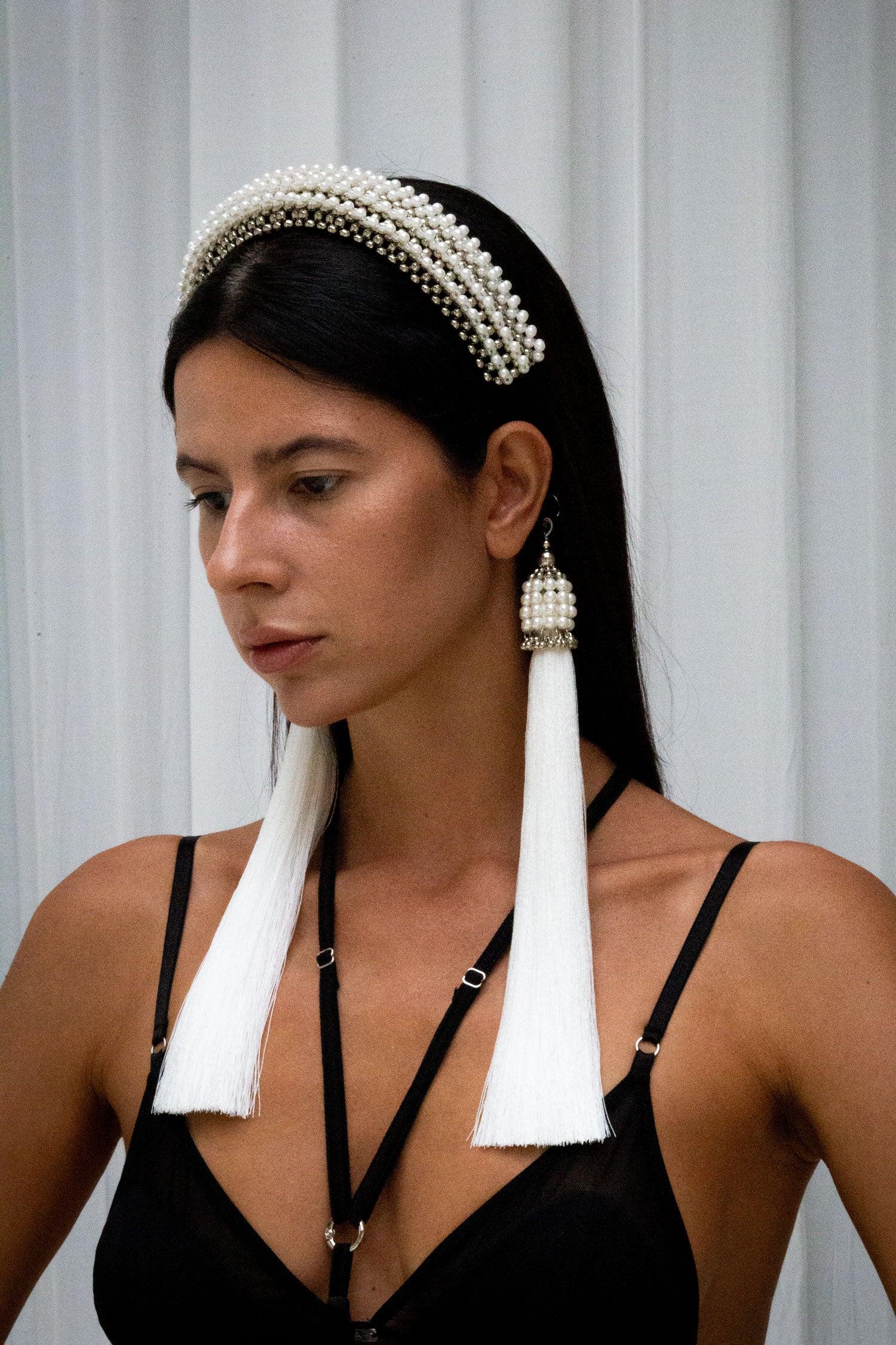 woman wears Anais Headband in pearl showing side face with black outfit in neutral background by object & dawn