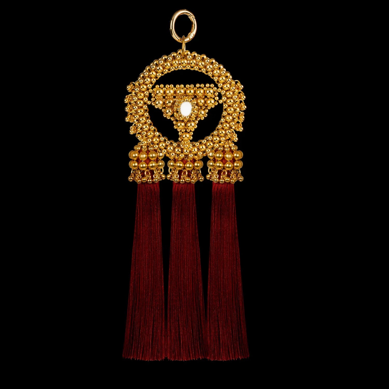 handcrafted modular anais medallion in gold with burgundy threads by object and dawn