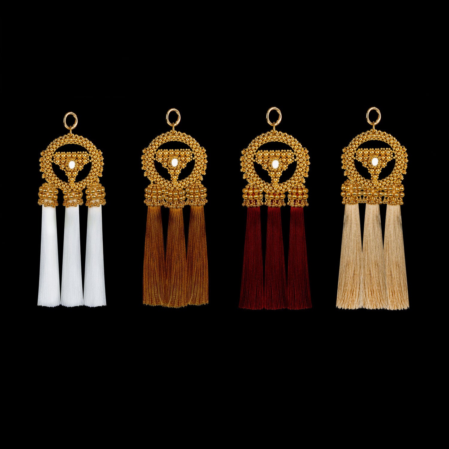 Set of four Anais Medallions in different colors with gold beads on a black background by Object&amp;Dawn