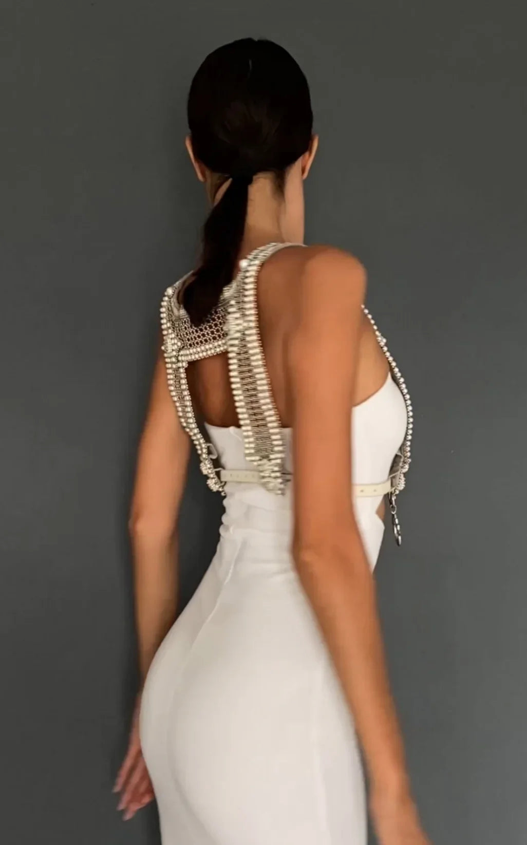 woman in white outfit wear artemisia mesh top in pearl with grey background