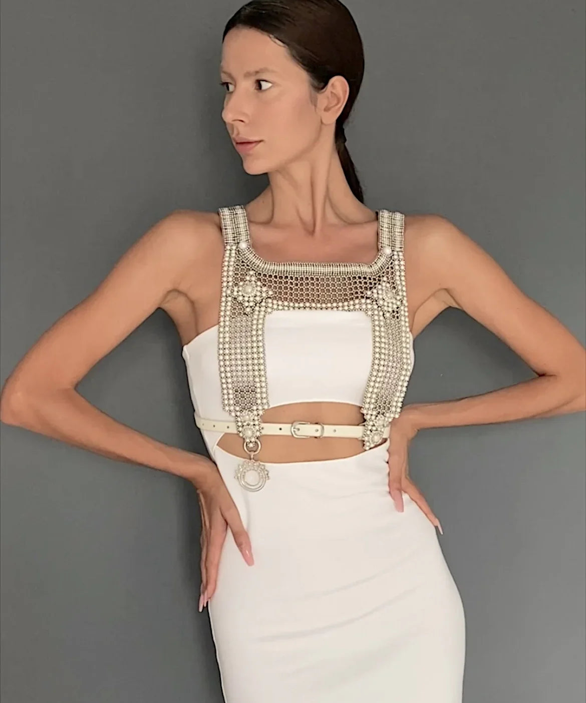 woman in white outfit wear artemisia mesh top in pearl with grey background