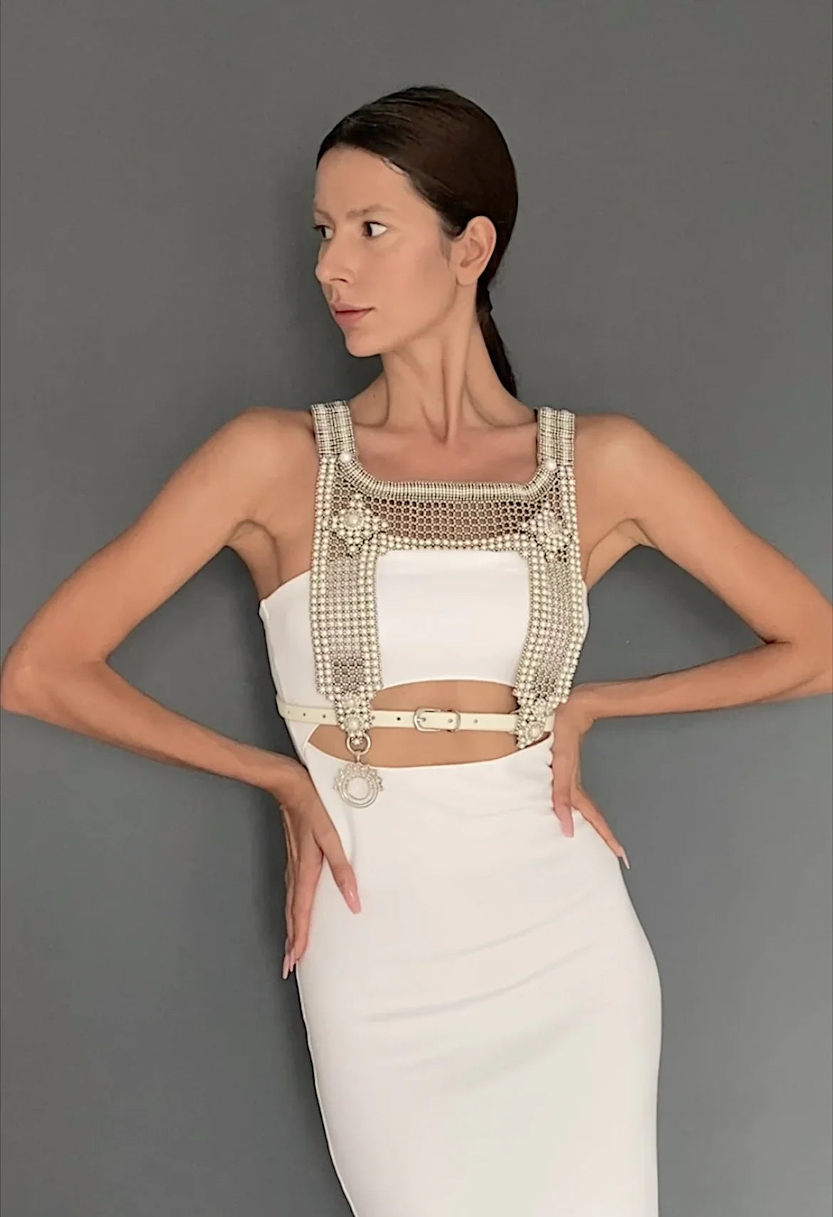 woman in white outfit wear artemisia mesh top in pearl with grey background