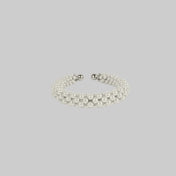 handcrafted modular beaded wrist bracelet with polymer metal beads with silver coated and synthetic
 japanese pearl by object and dawn side view