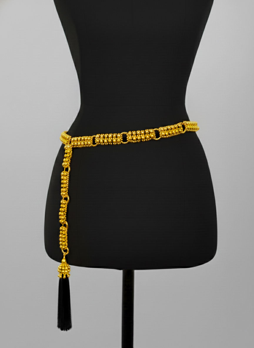 Beaded Adjustable Chain belt with tassels by Object & Dawn on a black mannequin against a gray background