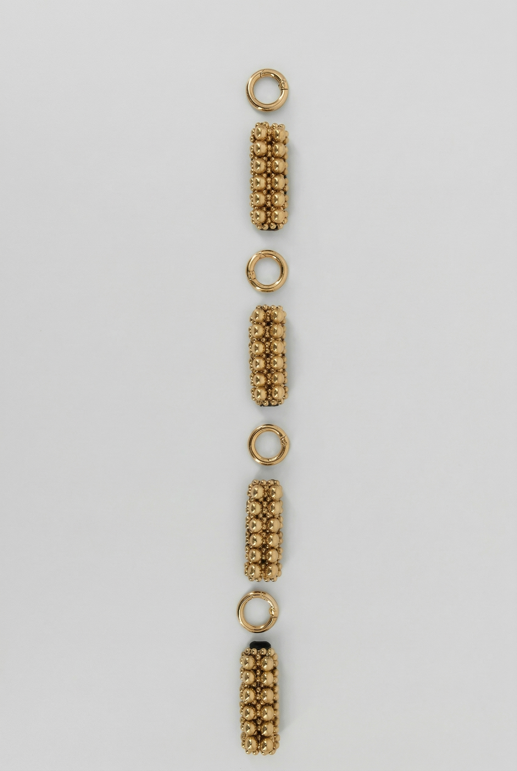 macro detail of delicate beaded link construction of beaded link gold by Object & Dawn