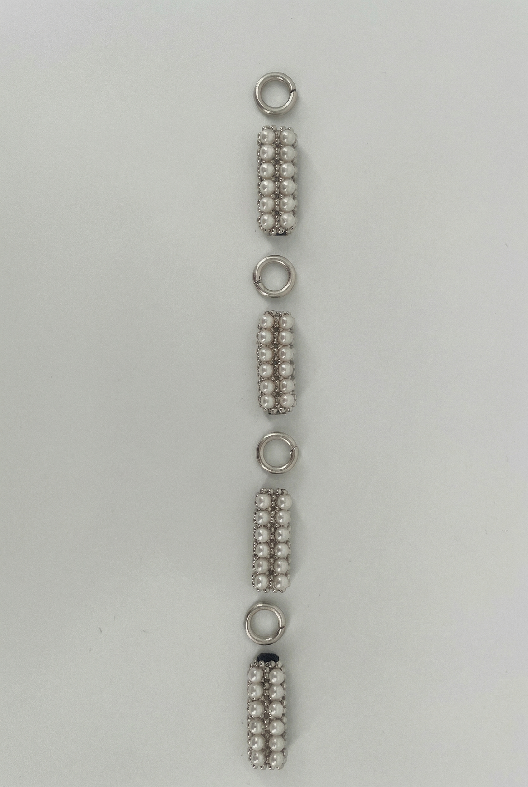 Object & Dawn headband featuring pearl intricate beaded links with unconected claps craftsmanship