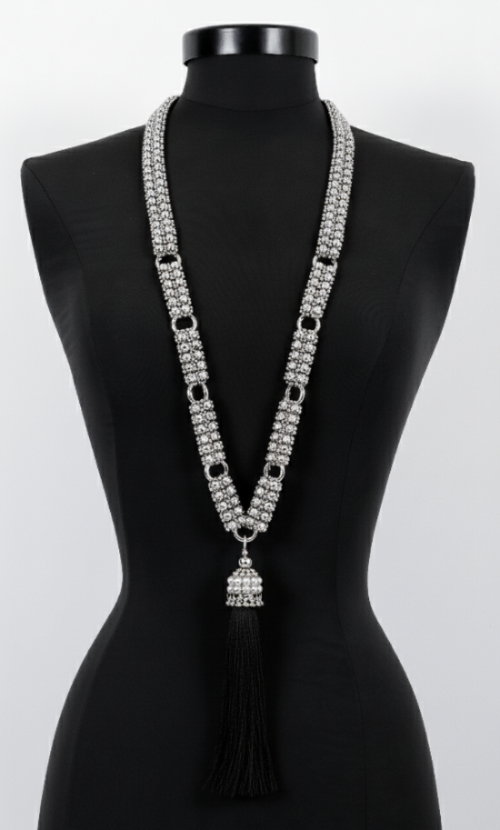 Beaded Link Neklace By Object & Dawn with tassel on a black mannequin against a white background