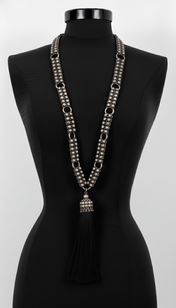 Beaded Link Neklace with tassel  By Object & Dawn on a black mannequin against a white background