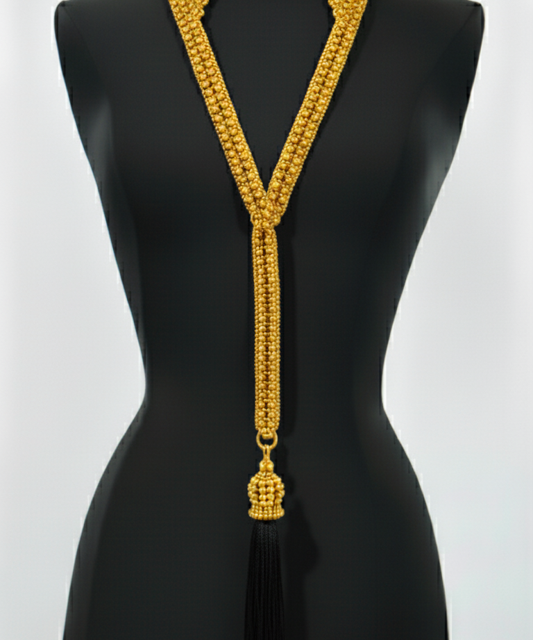 Beaded Tailored Collar Gold  with tassel by Object & Dawn on a black mannequin against a white background