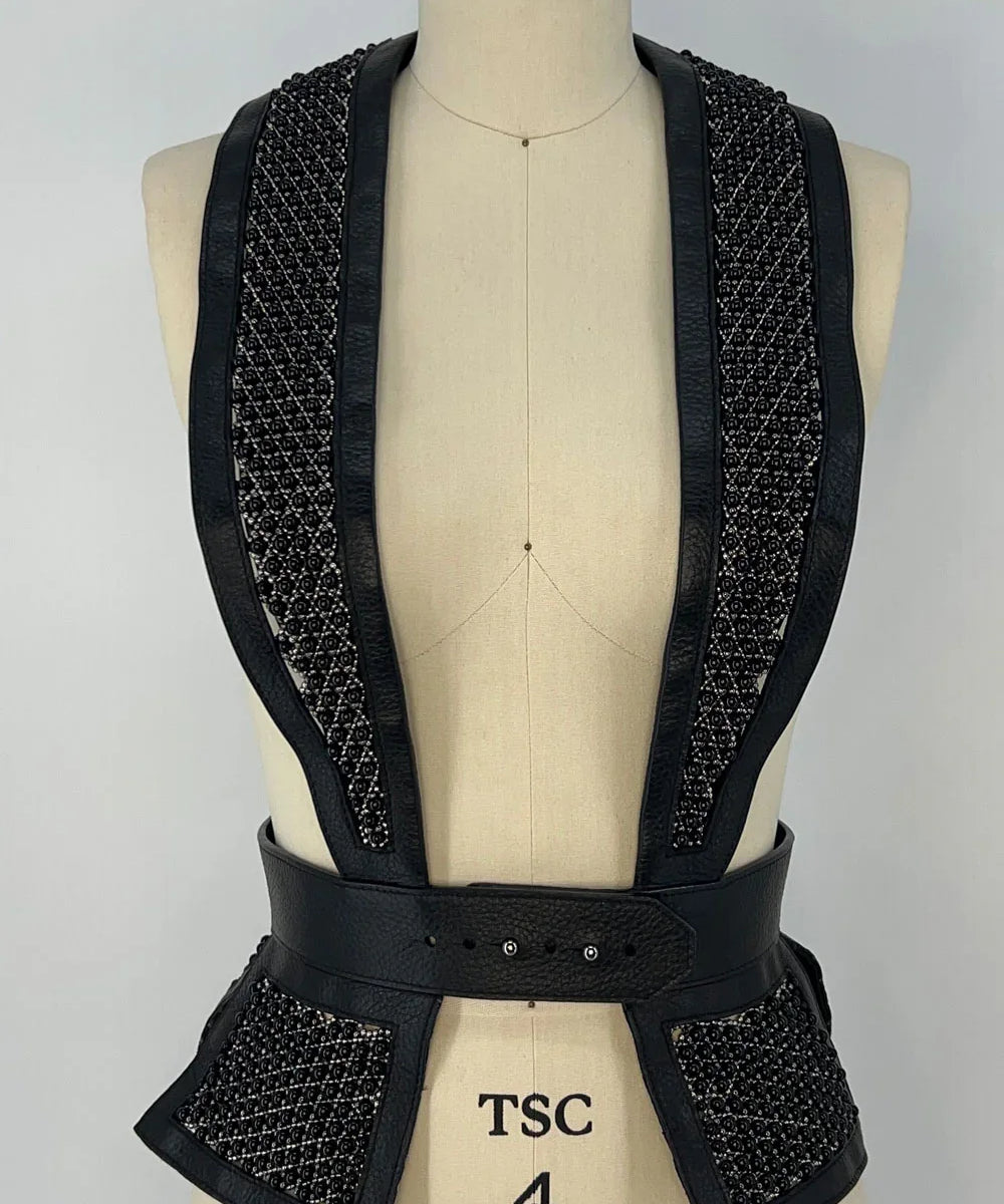 woman wears premium handracfted modular dietrich leater beaded tuxedo in black by object and dawn front view