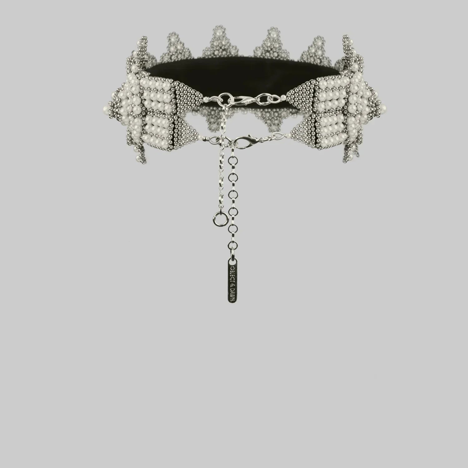 object and dawn eingana crown pearl on neutral background ghost image back view