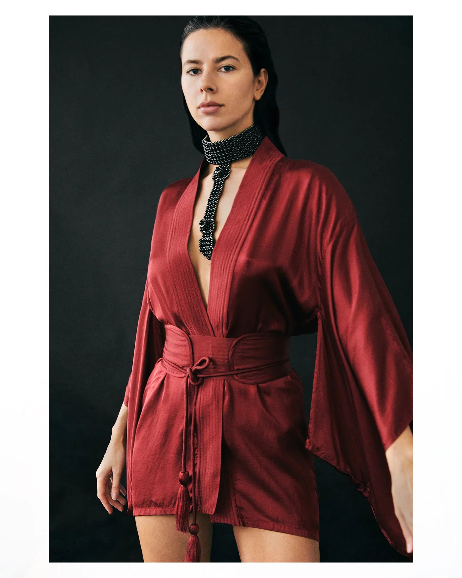 Object & Dawn Elohim T-Choker jet blackwith Mineko Short SIlk Kimono burgundy worn by woman in black background