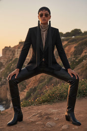 Woman in a stylish outfit  with Freja Headband in Jetblack with 22" Tassels by Object & Dawn with a scenic background