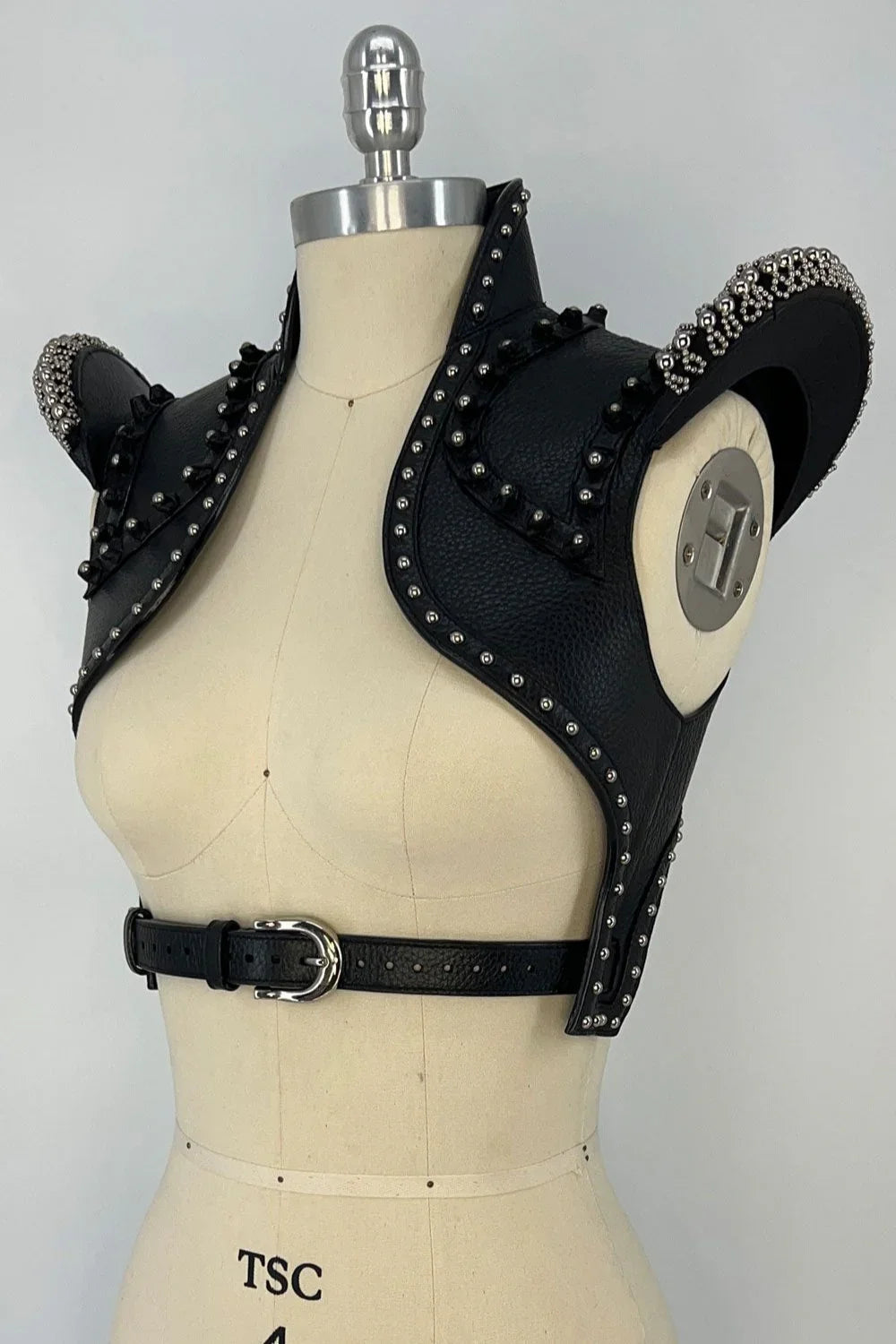 beaded premium leather helios bolero jacket by object and dawn in grey background diagonal view