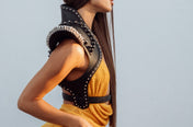 side body of woman with orange outfir wear helios leather beaded bolero by object and dawn