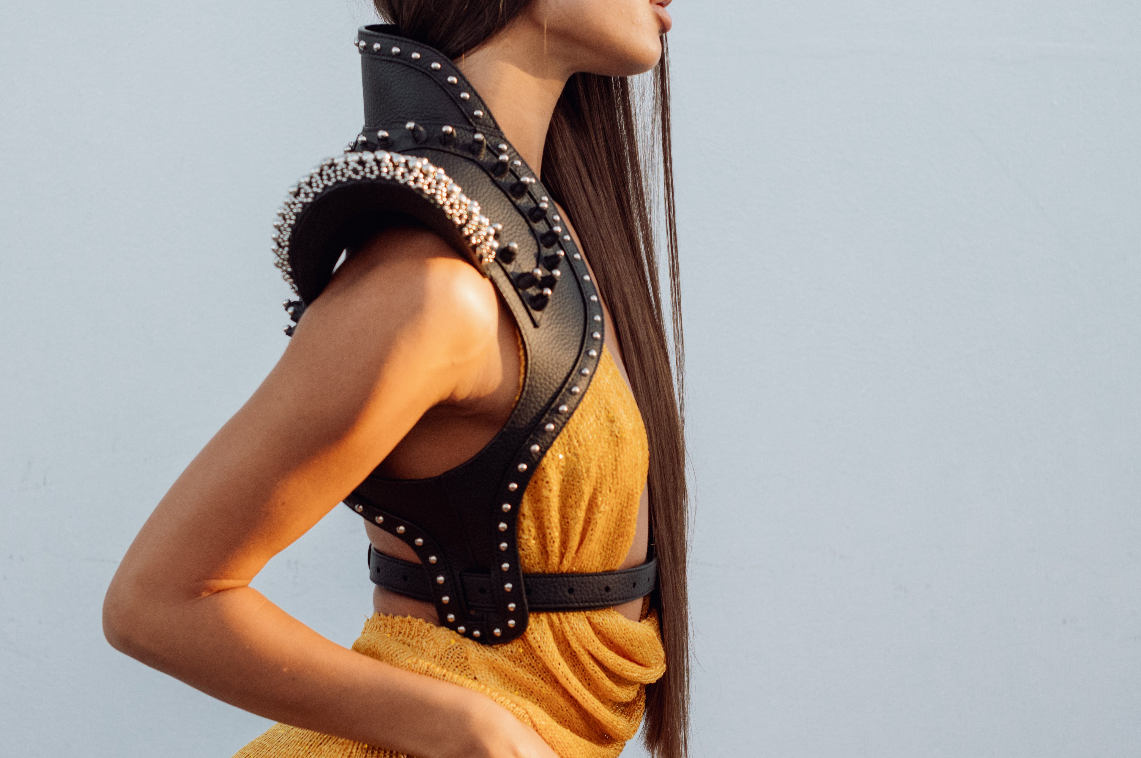 side body of woman with orange outfir wear helios leather beaded bolero by object and dawn