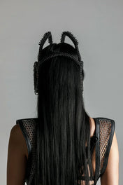 Woman showing the back look o Helois modular headpiece system jetblack by object and dawn