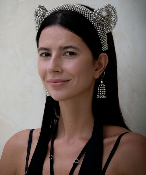 A woman with black long hair wearing Tamoe SIlk Harness Skirt and a jas headband in silver by Object&Dawn