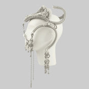 Object and Dawn, modular headpiece system in pearl with removable tassels and pearl medallion in grey background, ghost image side view