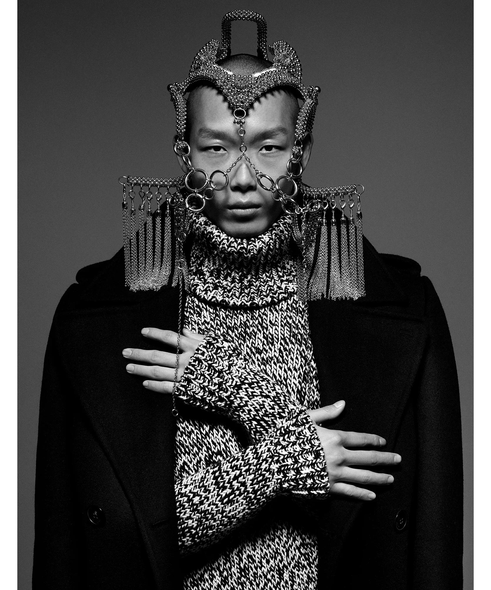 man with modular headpiece system in silver with grey sweater and black coat by object and dawn