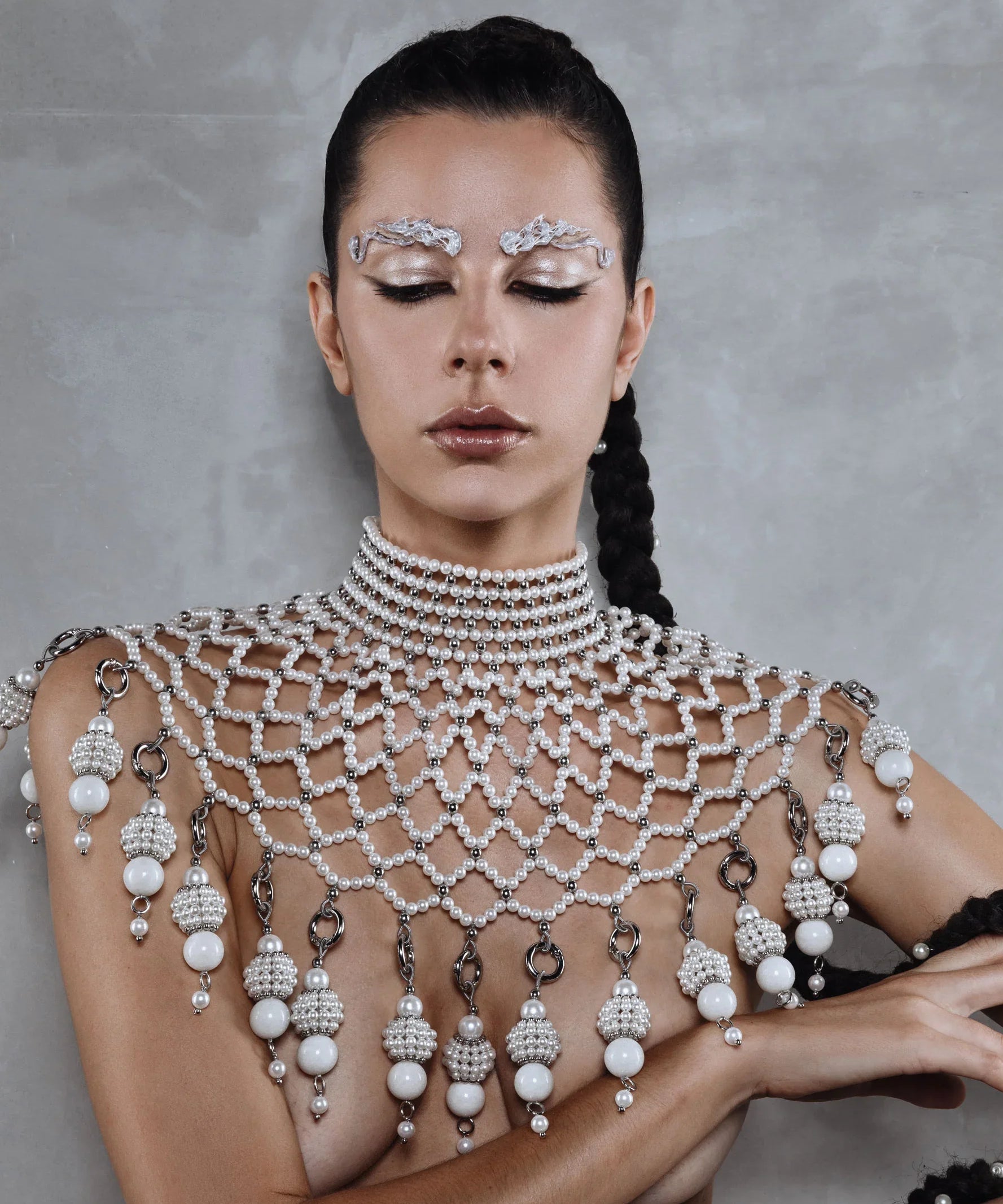 handcrafted large pearl medallion on freja modular cape by object and dawn