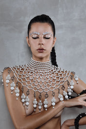 handcrafted large pearl medallion on freja modular cape by object and dawn