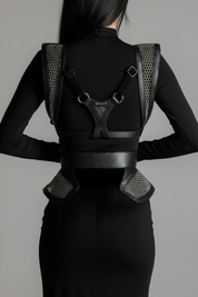 Woman wearing a black outfit standing against a gray background by Lister Beaded Bodice and Girdle by Object & Dawn