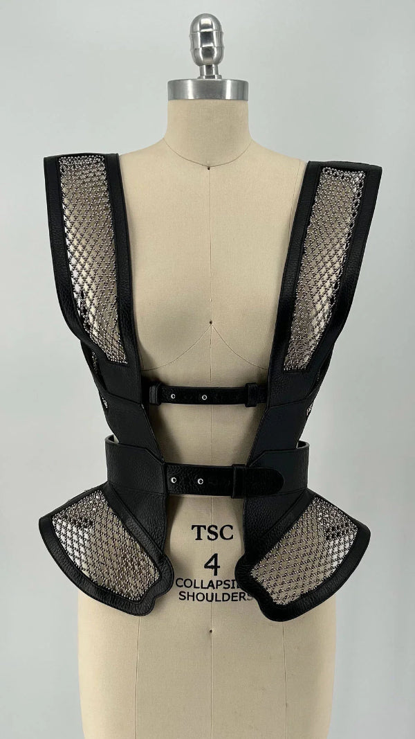 Black beaded mesh and leather top on a mannequin front