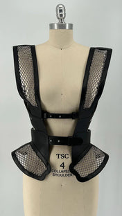 Black beaded mesh and leather top on a mannequin front