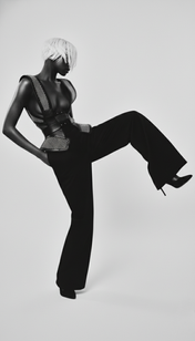 black woman with blonde hair wear Lister Mesh Beaded Leather Bodice with black long pants and pair of heels by object and dawn