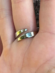detail look of inside ring of mata hari ring & jewelry on finger by object and dawn