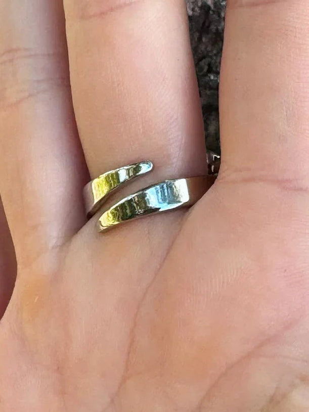 detail look of inside ring of mata hari ring & jewelry on finger by object and dawn