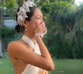 Bride Monika wearing Eingana Crown and Mata Hari bracelet in pearl by Object &amp; Dawn on her wedding day.