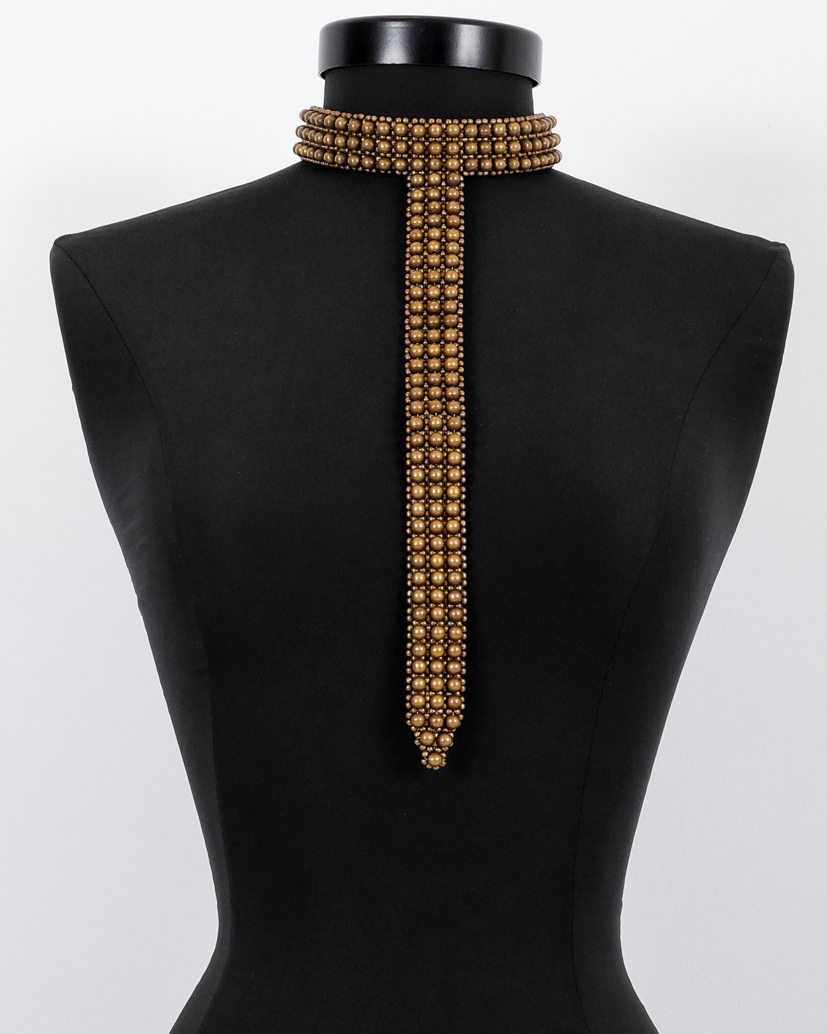 Signature Slim T-Choker Antq gold on a black mannequin against a white background by Object & Dawn