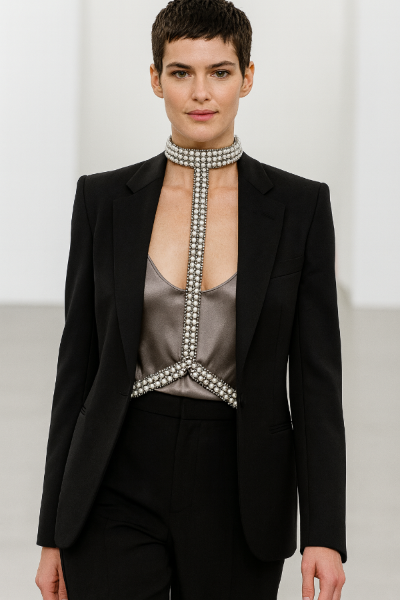 Woman wearing a black blazer with a T-Shape Harness Pearl Silver by Object & Dawn against a white background