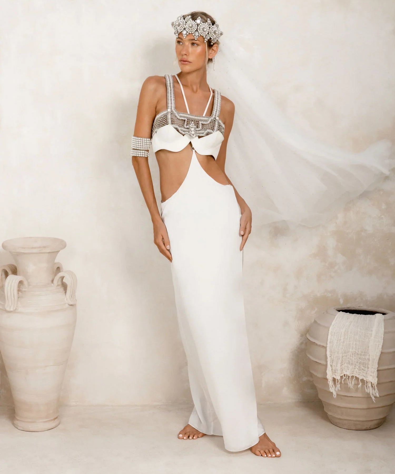woman in white harness skirt in white with bridal outfit by object and dawn