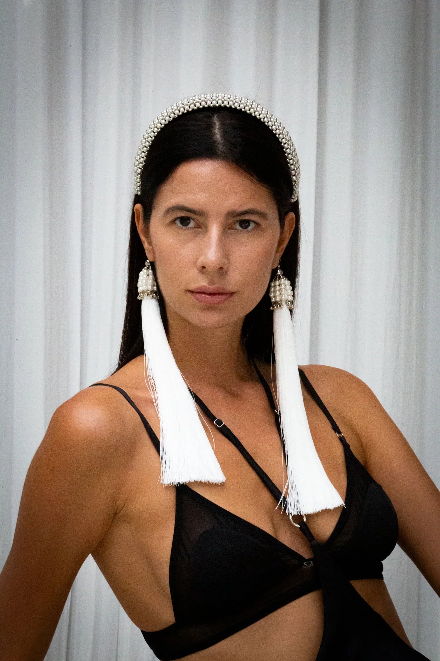 woman wear teuta headband in pearl by object & dawn facing camera on neutral background