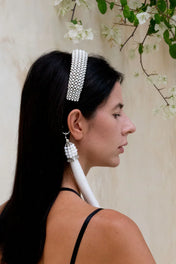 Object & Dawn beaded teuta headband in pearl with 11" tassels pearl worn by woman in neutral background