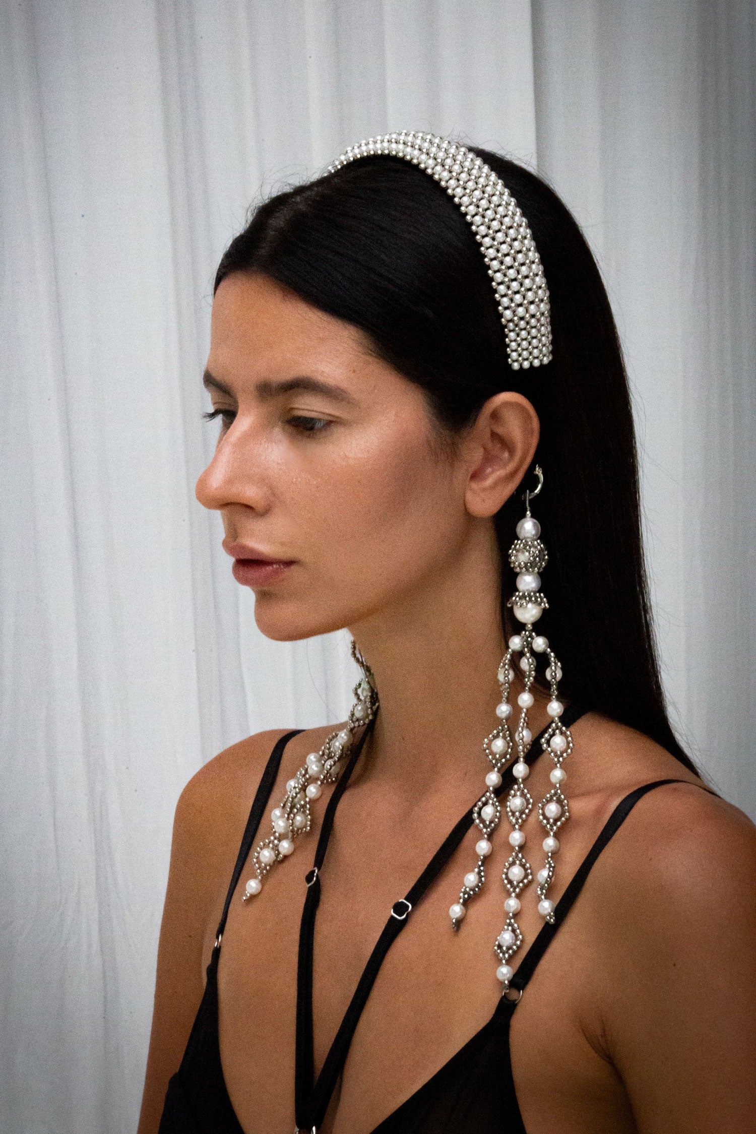 woman wear Teuta Headband pearl with trinity medallions in neutral background by object & dawn