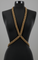 X-Shape Harness Necklace gold on a black mannequin against a gray background by Object & Dawn