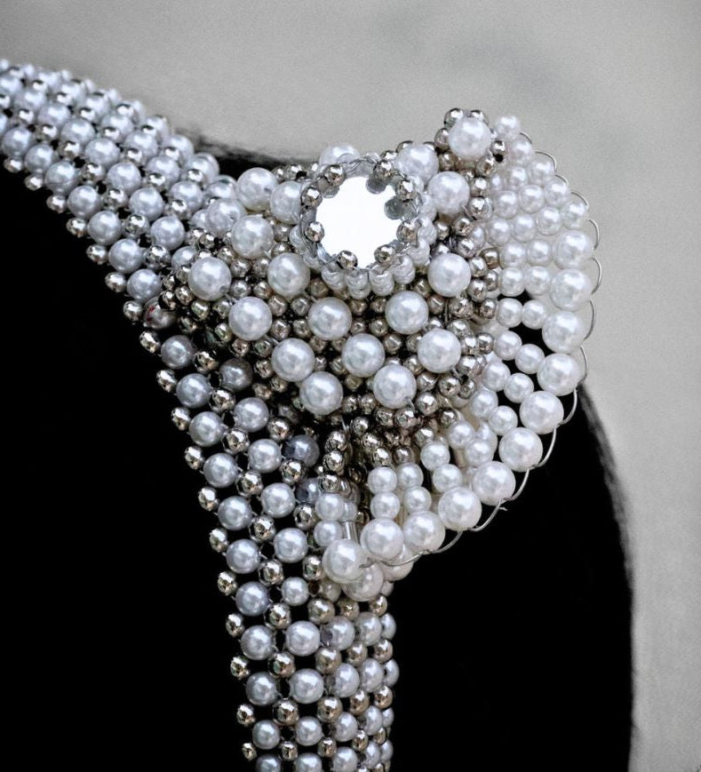 pearl beaded Jas headband worn by a person with a neutral background